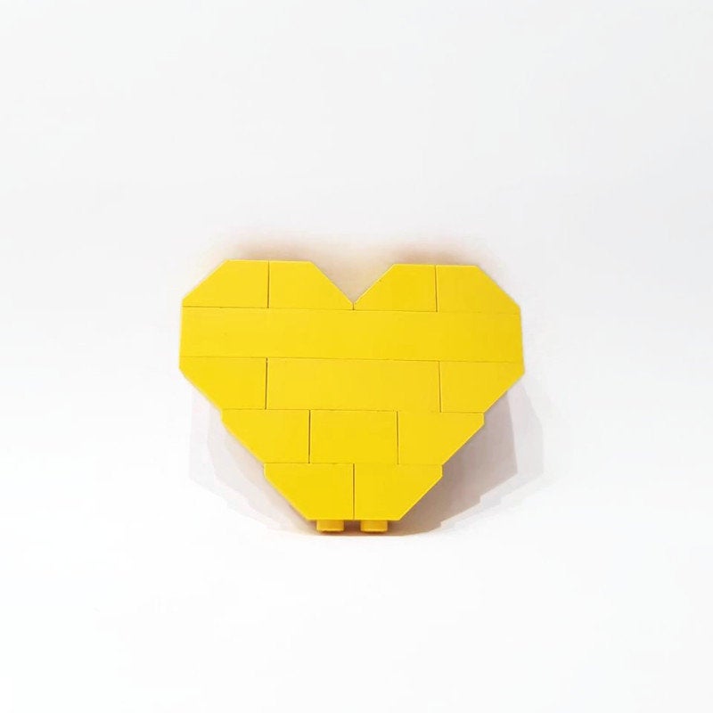 yellow love heart pin from building bricks
