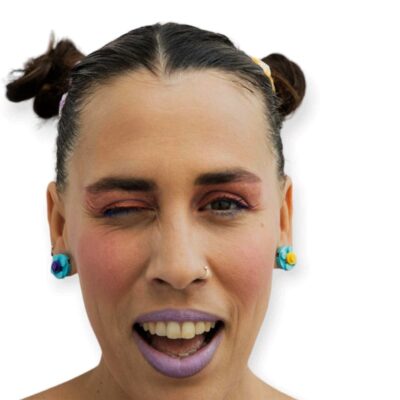 Modern woman wearing think bricks turquoise flower earrings
