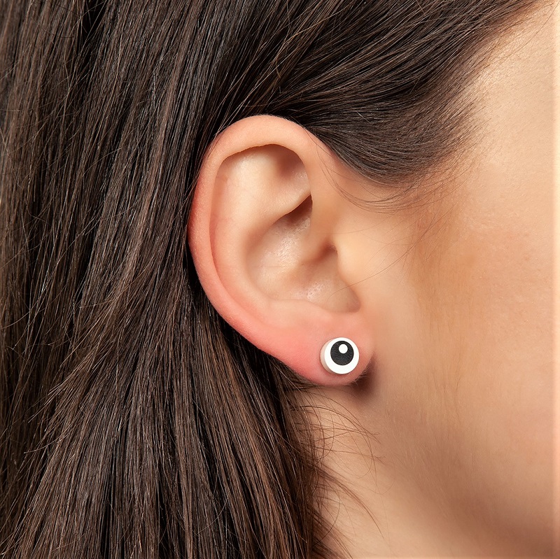 unique lego eye earring on a girls ear