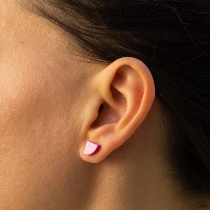 pink earrings made from legos on a woman