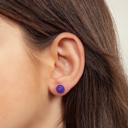 dark purple round earrings on brunnete
