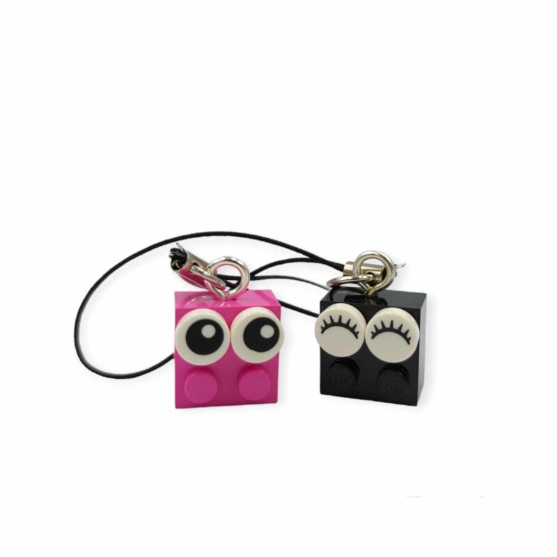 pink and black lego zipper pull
